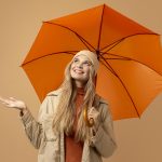 Woman shielded by umbrella